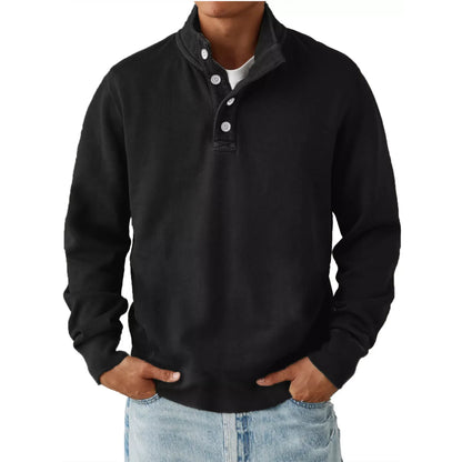 Men's black long sleeve sweatshirt with button detail on collar worn with light blue jeans