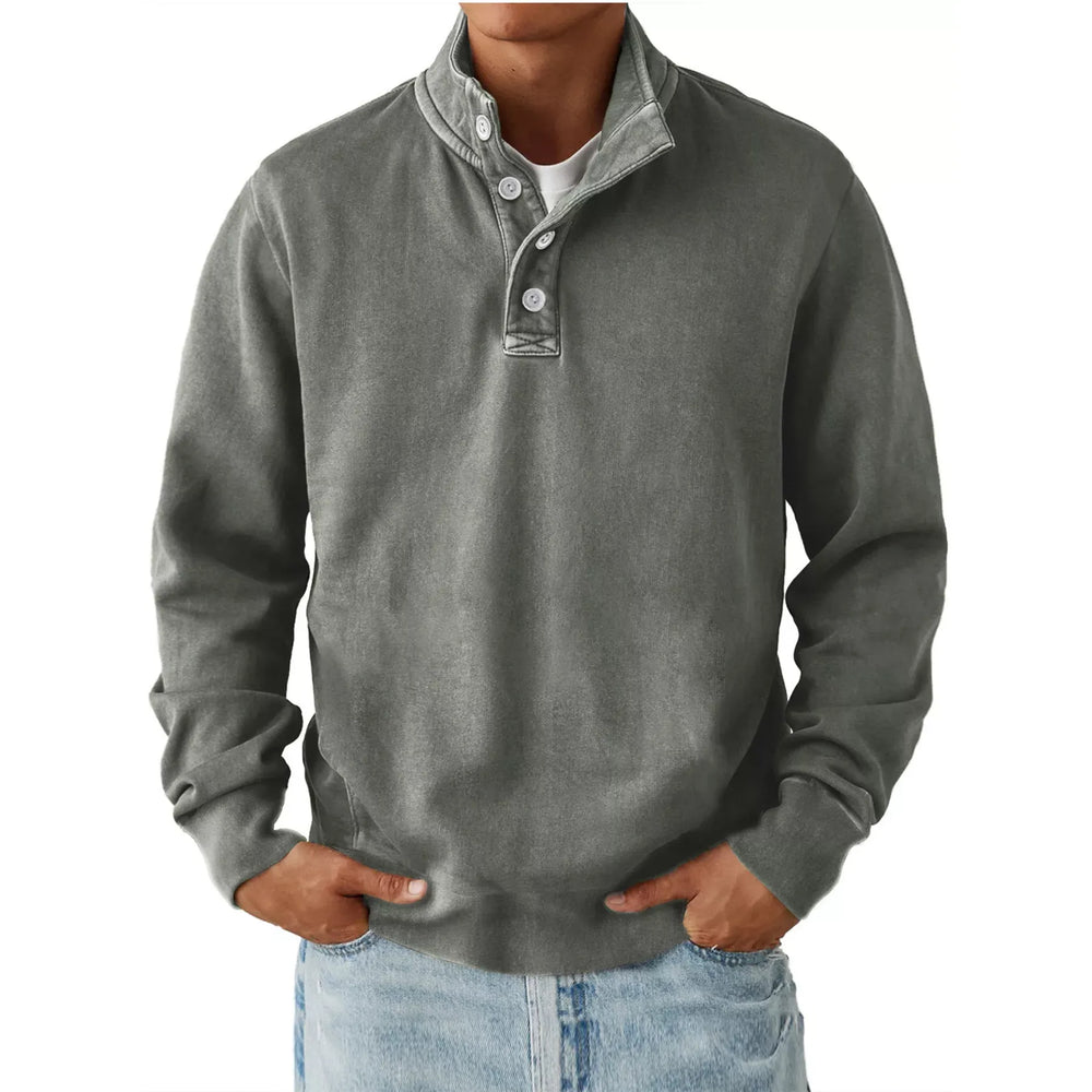 Men's gray long sleeve sweatshirt with button detail and stand collar, paired with light blue jeans